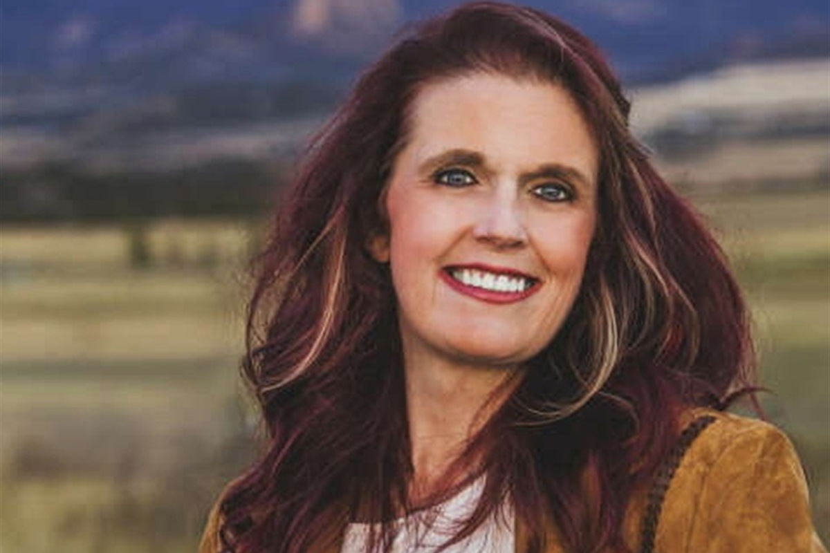 Christi Anderson photographed in the North Fork Valley mountains, representing Longitude Wellness care for Crawford, Hotchkiss, Paonia, and Western Colorado.
